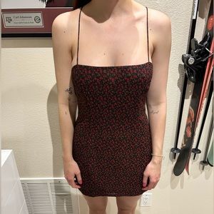 Princess Polly black mini dress with rose detailing